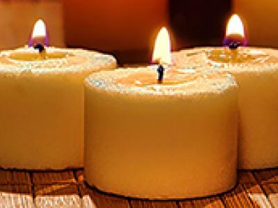 multiple clustered candles burning